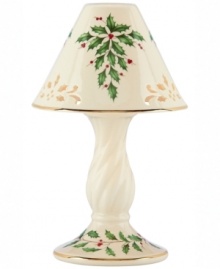 With bands of gold, pierced detail and a holly motif to match the beloved Holiday dinnerware pattern, this porcelain candle lamp from Lenox creates instant Christmas ambiance. With bands of gold, pierced detail and a holly motif to match the beloved Holiday dinnerware pattern, this porcelain candle lamp from Lenox creates instant Christmas ambiance.