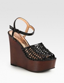 Mesh-like woven leather with an adjustable ankle strap, finished with a chunky wooden wedge and platform. Wooden wedge, 5 (125mm)Wooden platform, 2 (50mm)Compares to a 3 heel (75mm)Leather upperLeather liningRubber solePadded insoleImportedOUR FIT MODEL RECOMMENDS ordering one half size up as this style runs small. Mesh-like woven leather with an adjustable ankle strap, finished with a chunky wooden wedge and platform. Wooden wedge, 5 (125mm)Wooden platform, 2 (50mm)Compares to a 3 heel (75mm)Leather upperLeather liningRubber solePadded insoleImportedOUR FIT MODEL RECOMMENDS ordering one half size up as this style runs small.
