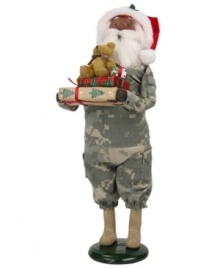 Singing their praises, Santa Claus honors military families in a camouflage suit and iconic red hat. In his arms are extra-special gifts piled high and topped with an adorable stuffed bear. An all-American figurine, handcrafted by Byers' Choice. Singing their praises, Santa Claus honors military families in a camouflage suit and iconic red hat. In his arms are extra-special gifts piled high and topped with an adorable stuffed bear. An all-American figurine, handcrafted by Byers' Choice.