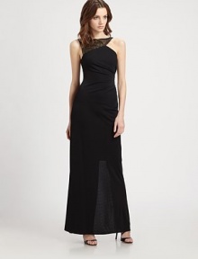 A shimmering sequined yoke and asymmetrical pleats lend allure to this floor-length silhouette.Modified boatneckSequined yokeSleevelessSide pleatingBack slitAsymmetrical back zipAbout 46 from natural waistPolyesterDry cleanImportedModel shown is 5'10 (177cm) wearing US size Small. 