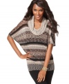 A couture-inspired zigzag metallic knit gives INC's slouchy tunic sweater a touch of shine! Perfect for adding pop to leggings and jeans.