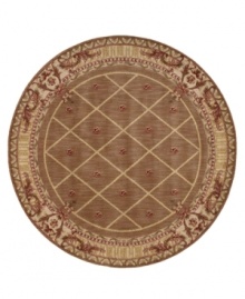 Infusing classic design with modern flair, this round rug features a striking lattice pattern studded with rosettes on a weathered cocoa ground, bordered with floral and vine accents. A premium wool weave imparts rich texture and indulgent softness. Infusing classic design with modern flair, this round rug features a striking lattice pattern studded with rosettes on a weathered cocoa ground, bordered with floral and vine accents. A premium wool weave imparts rich texture and indulgent softness.
