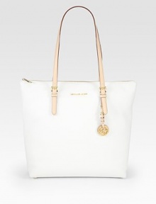 A roomy shape of sumptuous venus leather is minimalistic and instantly chic. Double adjustable top handles, 9¼-11 dropTop zip closureOne outside open pocketProtective metal feetOne inside zip pocketFour inside open pocketsLogo-printed lining16W X 13½H X 5DImported