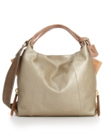 A hint of sheen gives this high-style shoulder bag by Furla a playful yet sophisticated feel. Genuine leather with a pearlized finish is perfectly complimented by goldtone hardware and signature charms. A hint of sheen gives this high-style shoulder bag by Furla a playful yet sophisticated feel. Genuine leather with a pearlized finish is perfectly complimented by goldtone hardware and signature charms.