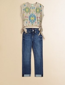 A colorful Navajo print and eye-catching side tie hem make this every day knit a must-have.ScoopneckSleevelessPullover styleSide tie hem90% rayon/10% polyesterMachine washMade in the USA