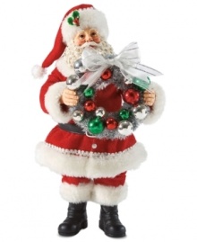 All the bells & whistles! With a decorative Christmas ball wreath in hand, this Santa figurine evokes the happiness associated with hanging holiday trim. All the bells & whistles! With a decorative Christmas ball wreath in hand, this Santa figurine evokes the happiness associated with hanging holiday trim.