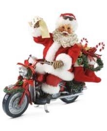 Look who's got a new set of wheels! Santa is delivering gifts on his decked out motorcycle, complete with festive ribbon, garland and stockings. Look who's got a new set of wheels! Santa is delivering gifts on his decked out motorcycle, complete with festive ribbon, garland and stockings.