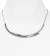 Special and sophisticated. This beautifully crafted Judith Jack collar necklace flaunts effortlessly elegance, dressed up in sterling silver with marcastite stations.
