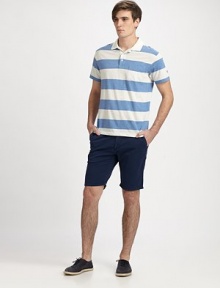 A trim, modern fit from luxurious cotton jersey, defines this striped polo shirt with nautical-inspired style.Three-button placketChest patch pocketCottonMachine washImported