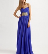 Brightly-hued silk chiffon, in a flowing, floor-length style embellished with glamorous beading.Strapless sweetheart necklineRuched bodiceBeaded waistbandConcealed back zipFully linedAbout 48 from natural waistSilkDry cleanImportedModel shown is 5'11 (180cm) wearing US size 4. 