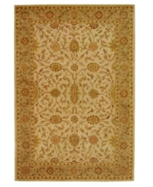A beautifully balanced vine-and-blossom motif is captured in hushed ivory tones on this awe-inspiring area rug from Safavieh. Tufted in India from pure wool, this rug emerges from the annals of antiquity to bring spectacular style and time-honored quality to your home. (Clearance) A beautifully balanced vine-and-blossom motif is captured in hushed ivory tones on this awe-inspiring area rug from Safavieh. Tufted in India from pure wool, this rug emerges from the annals of antiquity to bring spectacular style and time-honored quality to your home. (Clearance)