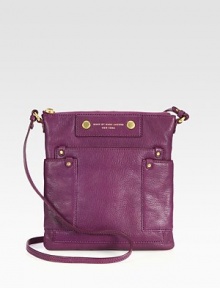 A slim and chic style in luxurious pebbled leather with radiant hardware.Adjustable shoulder strap, 17-19 dropTop zip closureThree outside open pocketsOne inside zip pocketTwo inside open pocketsFully lined9½W X 10H X ½DImported