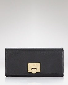 A plethora of pockets and convenient cards slots lets you tote all your essentials with understated elegance. Carryall by MICHAEL Michael Kors.