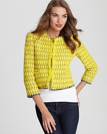 A sunny Alice + Olivia tweed jacket features fringe trim, lending a youthful element to the classic texture. The perfect finishing piece to denim and tee pairings, this lighthearted layer is a new-season must.