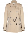 With heritage detailing reflecting the original Burberry trench coat, this short cotton gabardine version from Burberry London counts as an iconic, multi-season investment - Classic collar with belted latch and hook closure, set-in long sleeves with belted cuffs, epaulettes, gun flap, double-breasted button-down front, belted waist, rain shield - Fitted silhouette - Pair with slim trousers or jeans and a cashmere pullover