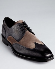 A suede vamp separates the leather toe and back of this highly distinguished derby shoe from Salvatore Ferragamo, exquisitely rendered for an allover fine design. A suede vamp separates the leather toe and back of this highly distinguished derby shoe from Salvatore Ferragamo, exquisitely rendered for an allover fine design.