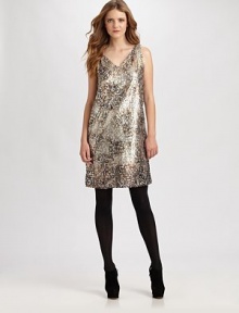 Allover sequins make this sleeveless knit dress a party-perfect must-have for the season.V-neckSleevelessPlunge backAllover sequinsConcealed back zip closureAbout 37 from shoulder to hemPolyesterDry cleanImported Model shown is 5'10½ (179cm) wearing US size Small. Allover sequins make this sleeveless knit dress a party-perfect must-have for the season.V-neckSleevelessPlunge backAllover sequinsConcealed back zip closureAbout 37 from shoulder to hemPolyesterDry cleanImported Model shown is 5'10½ (179cm) wearing US size Small.