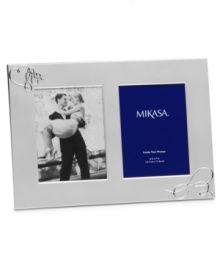 Show your romantic side. Loopy hearts in this silver-plated Love Story picture frame showcase a special moment or two with elegant whimsy. From Mikasa. Show your romantic side. Loopy hearts in this silver-plated Love Story picture frame showcase a special moment or two with elegant whimsy. From Mikasa.