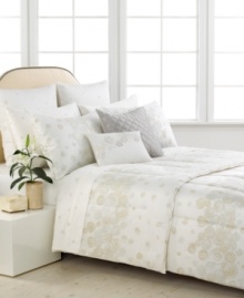 An embroidered conch shell pattern on a clean white ground embellishes this decorative pillow from Barbara Barry for a serene appeal. An embroidered conch shell pattern on a clean white ground embellishes this decorative pillow from Barbara Barry for a serene appeal.