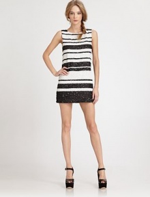 A dazzling beaded sheath styled with variegated stripes for eye-popping graphic chic.ScoopneckSleevelessFlat frontCenter back zipperAbout 16 from natural waist97% silk/3% spandexDry cleanImportedModel shown is 5'9 (175cm) wearing US size 4.