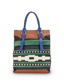 THE LOOKAdjustable, contrast tubular leather double top handlesOpen topFront multicolor tribal-inspired cutout leather designOne outside zip pocketOne inside zip pocketTwo inside open pocketsInside logo detailTHE MEASUREMENTDouble top handles, 6 drop12W X 14H X 5½DTHE MATERIALLeatherLogo printed liningORIGINImported