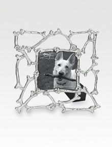 A whimsical frame inspired by the most important members of the family (and the treats they love), crafted with a lattice of dog bones in nickelplated stainless steel. Fits a 3 X 3 photographOverall, 6½ X 6½ totalImported A whimsical frame inspired by the most important members of the family (and the treats they love), crafted with a lattice of dog bones in nickelplated stainless steel. Fits a 3 X 3 photographOverall, 6½ X 6½ totalImported