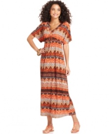 Make a bold statement in One World's maxi dress, featuring an allover mixed print and flattering silhouette. Make a bold statement in One World's maxi dress, featuring an allover mixed print and flattering silhouette.