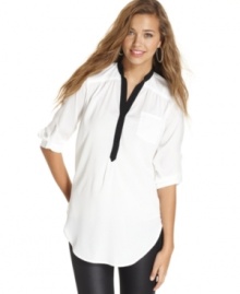 Black trims pop against the bright white hue of this tunic from BCX: a super-stylish piece that boasts easygoing, weekend cool. Black trims pop against the bright white hue of this tunic from BCX: a super-stylish piece that boasts easygoing, weekend cool.