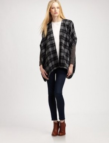 Give your cool-weather wardrobe a hit of flair with this plaid, mixed-media poncho with dropped shoulders and a lengthy silhouette. Open frontPoncho sleeves with rib-knit cuffsContoured asymmetrical hemAbout 29 from shoulder to hem50% acrylic/30% wool/20% nylonHand washImportedModel shown is 5'10 (177cm) wearing US size XS/S. Give your cool-weather wardrobe a hit of flair with this plaid, mixed-media poncho with dropped shoulders and a lengthy silhouette. Open frontPoncho sleeves with rib-knit cuffsContoured asymmetrical hemAbout 29 from shoulder to hem50% acrylic/30% wool/20% nylonHand washImportedModel shown is 5'10 (177cm) wearing US size XS/S.