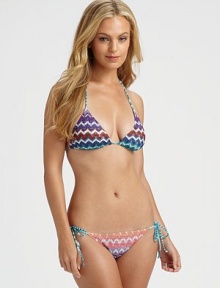 Opposites attract. This is especially true for two bold prints coming together to make the perfect swimsuit.Halter strap ties at neckBack tie closureTriangle cupsSide tiesStretch bottomViscoseHand washMade in Italy