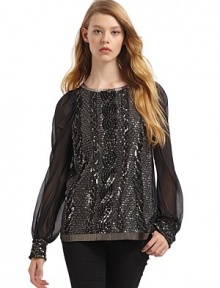 THE LOOKCrew necklineOrnate beadwork adorns the front bodice, cuffs and hemChiffon long sleeves with three-button-and-loop cuffsExposed back zipperTHE FITAbout 26 from shoulder to hemTHE MATERIALSilkCARE & ORIGINSpot cleanMade in USA of imported fabric THE LOOKCrew necklineOrnate beadwork adorns the front bodice, cuffs and hemChiffon long sleeves with three-button-and-loop cuffsExposed back zipperTHE FITAbout 26 from shoulder to hemTHE MATERIALSilkCARE & ORIGINSpot cleanMade in USA of imported fabric