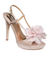 Oversized flowers make these pumps so pretty. Badgley Mischka's Zabrina platform sandals feature a sexy slingback ankle strap with a side buckle.