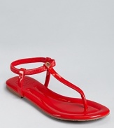 Slick and simple, the Tory Burch Vickie sandals lend summer style in glossy patent leather. A stretchy ankle strap allows for easy on-and-off.