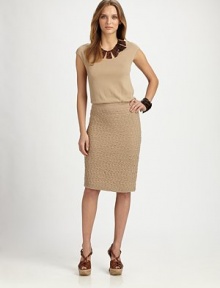 A soft, smooth bodice leads to a flattering drop waist and a textured skirt for a flirty touch.ScoopneckCap sleevesBanded drop waistTextured skirtGathered details at backAbout 38 from shoulder to hem55% rayon/45% nylonDry cleanImported Model shown is 5'10½ (179cm) wearing US size Small. 