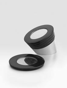 A ruggedly elegant pairing of sleek black granite and signature alloy provide a touch of Southwestern sophistication while protecting tabletops from drips and water rings. Stacked together, the coasters resemble a dramatic outcrop of rock emerging from the ground. Set of 4 Gleaming metal center is tarnish-resistant Stacked, 4¼ high 4¾ diam. Hand wash Imported 