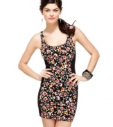 Blocks of banding at the sides create a sleek hourglass curve on this body-hugging, floral print tank dress from Material Girl!