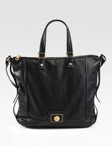 A roomy carryall in luxurious leather, perfectly sized for all your essentials.Double top handles, 7½Shoulder strap, 11½ dropTop zip closureProtective metal feetOne inside zip pocketTwo inside open pocketsFully lined16W X 13H X 4¾DImported