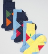 Pattern yourself out of classic style with these argyle and solid colored socks from Ralph Lauren.