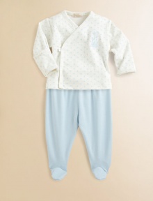 Dainty embroidery, polka dots and ruffles trim the top while a solid color styles the footed pants.V-neckLong sleeves with ruffled cuffsFront crossover snapsElastic waistPima cottonMachine washImported Please note: Number of snaps may vary depending on size ordered. Dainty embroidery, polka dots and ruffles trim the top while a solid color styles the footed pants.V-neckLong sleeves with ruffled cuffsFront crossover snapsElastic waistPima cottonMachine washImported Please note: Number of snaps may vary depending on size ordered.