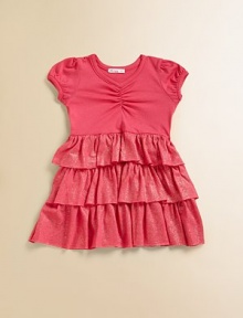This adorable knit is sweetly gathered on top and wonderfully tiered on the bottom, with wide rows of shimmering ruffles.Smooth jersey top with gathered V necklinePuff sleevesSparkle tiered skirt50% cotton/50% modalHand washMade in USA This adorable knit is sweetly gathered on top and wonderfully tiered on the bottom, with wide rows of shimmering ruffles.Smooth jersey top with gathered V necklinePuff sleevesSparkle tiered skirt50% cotton/50% modalHand washMade in USA