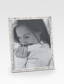 Pink mother-of-pearl tiles are pieced around a silverplated border to form a lustrous frame around any treasured photo. Accommodates a 8 X 10 photograph Overall: 8½ X 11 Imported Pink mother-of-pearl tiles are pieced around a silverplated border to form a lustrous frame around any treasured photo. Accommodates a 8 X 10 photograph Overall: 8½ X 11 Imported