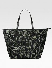 Signature graffiti transforms this roomy carryall crafted of durable nylon with smooth leather trim. Double leather top handles, 13 dropOpen topTwo inside open pockets13½W X 16H X 4½DMade in Italy