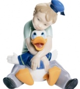 A childhood dream come true, this enchanting collectible depicts a young boy and Disney's Donald Duck in fine porcelain. From Nao by Lladro.