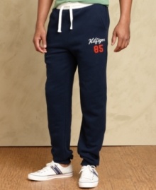 Cool casual comfort is easy to come by with these athletic pants from Tommy Hilfiger.