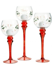 Etched and painted with a festive pattern of holly and berries, the red-stemmed Winterberry candlesticks from Pfaltzgraff make a merry impression in any holiday home. Etched and painted with a festive pattern of holly and berries, the red-stemmed Winterberry candlesticks from Pfaltzgraff make a merry impression in any holiday home.