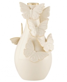 The essence of whimsy, this Lenox Flutter bud vase will lift your spirits with gold-tipped butterflies and elegant banding in timeless ivory porcelain. The essence of whimsy, this Lenox Flutter bud vase will lift your spirits with gold-tipped butterflies and elegant banding in timeless ivory porcelain.