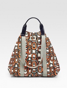 Bold print highlights this versatile cotton canvas carryall, finished with shoulder straps and patent leather top handles.Double top handles, 4½ dropShoulder straps, 10½ dropTop snap closureOne inside snap pocket7½W X 13H X 6¼DImported