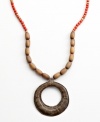 Full moon, full of potential. Strung with wooden beads and a hand-cut and hammered pendant, this Heart of Haiti necklace is crafted by a co-op that supports women's employment in local communities.