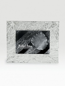 Delicately veined impressions of fallen leaves add a sylvan glow to favorite photos. Fits a 5 X 7 photoSilverplated and tarnish resistantHandmade in India Delicately veined impressions of fallen leaves add a sylvan glow to favorite photos. Fits a 5 X 7 photoSilverplated and tarnish resistantHandmade in India
