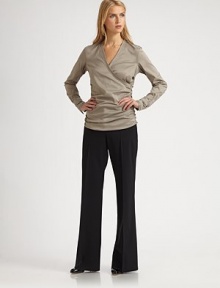 This wrap star with soft ruching is beyond lightweight...it is heavenly.V-neckRuching detailsLong sleeves with button tabs63% cotton/37% polyesterDry cleanImported Model shown is 5'10½ (179 cm) wearing US size 4. 